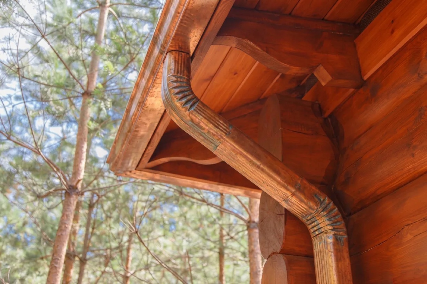 Corrugated copper downspout and elbow with developing patina