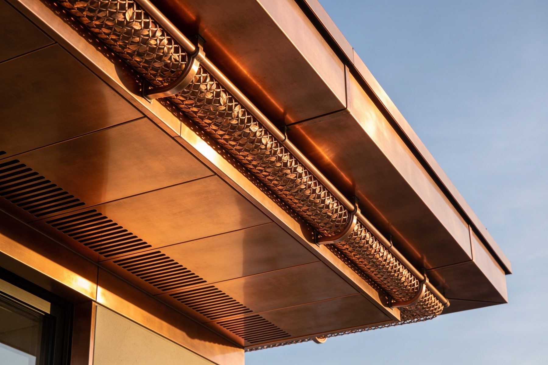 Copper soffit panels and gutter screen